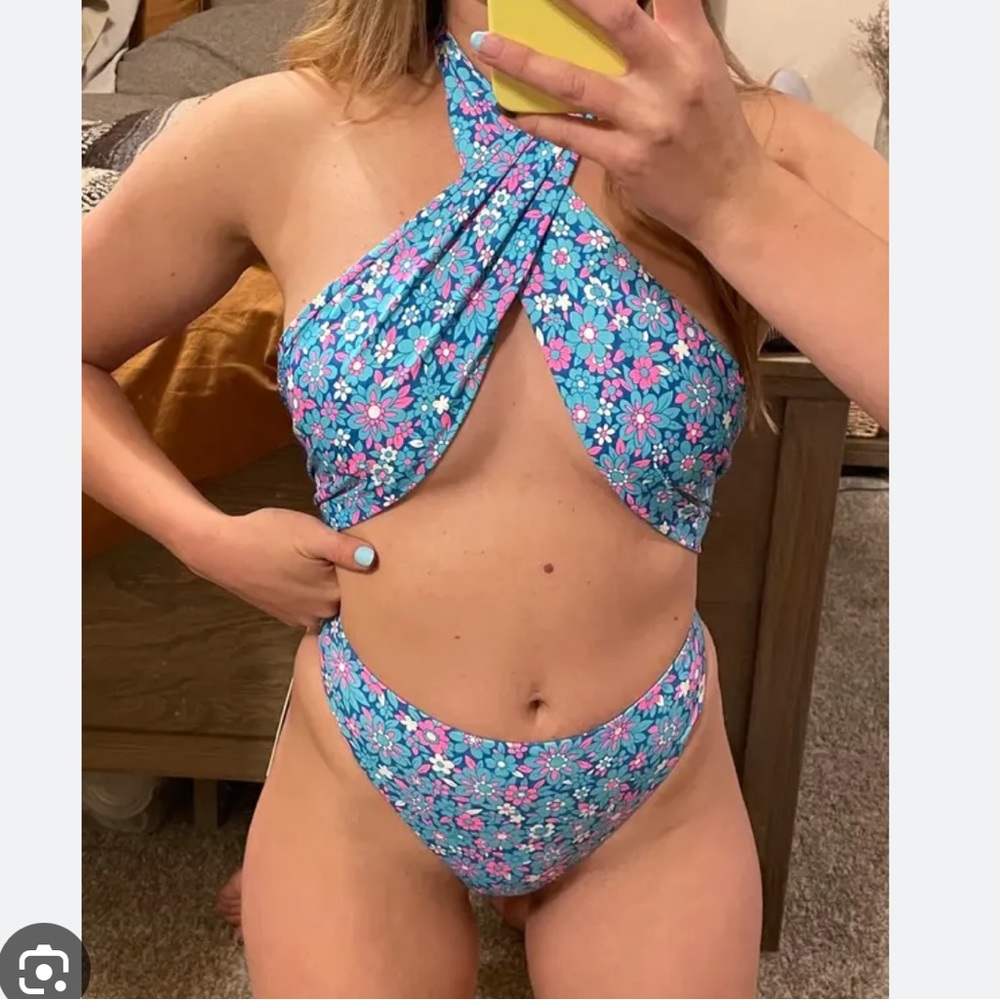 Frankie’s Bikinis Dorothy floral halter one piece swimsuit.